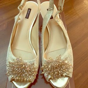 Gold ladies sling back dress shoe with low herl